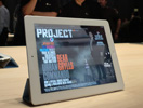 White iPad 2 standing up with the aid of the smart cover